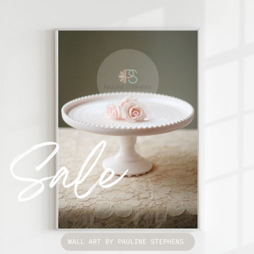 Graceful 1950s Jeannette Shell Pink Cake stand on a Vintage Lace Tablecloth Print- Enhance Your Space with Timeless Elegance display