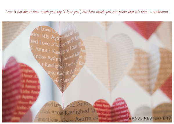 a photo of handmade hearts with different phrases of love from languages across the world